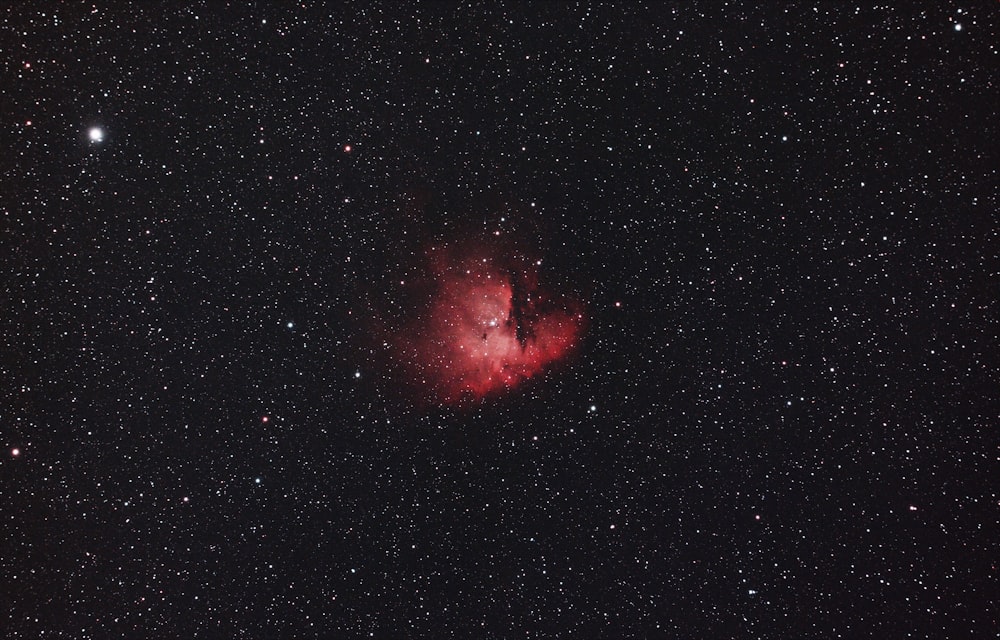 red and black galaxy with stars