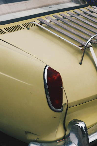 white car with red and gray door lever