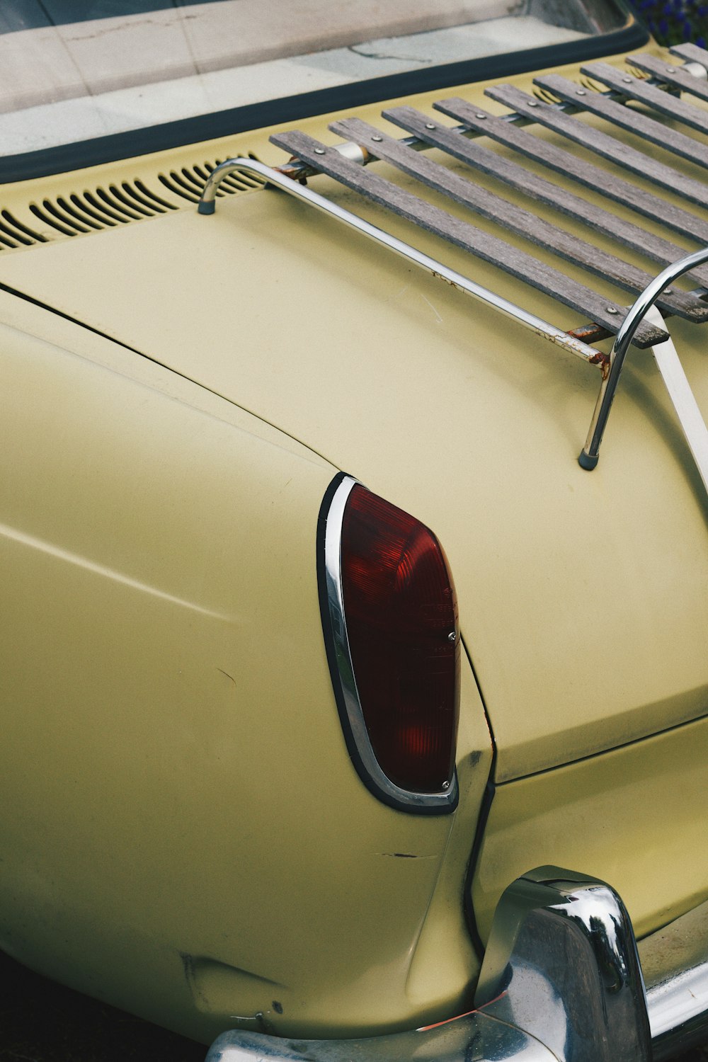 white car with red and gray door lever