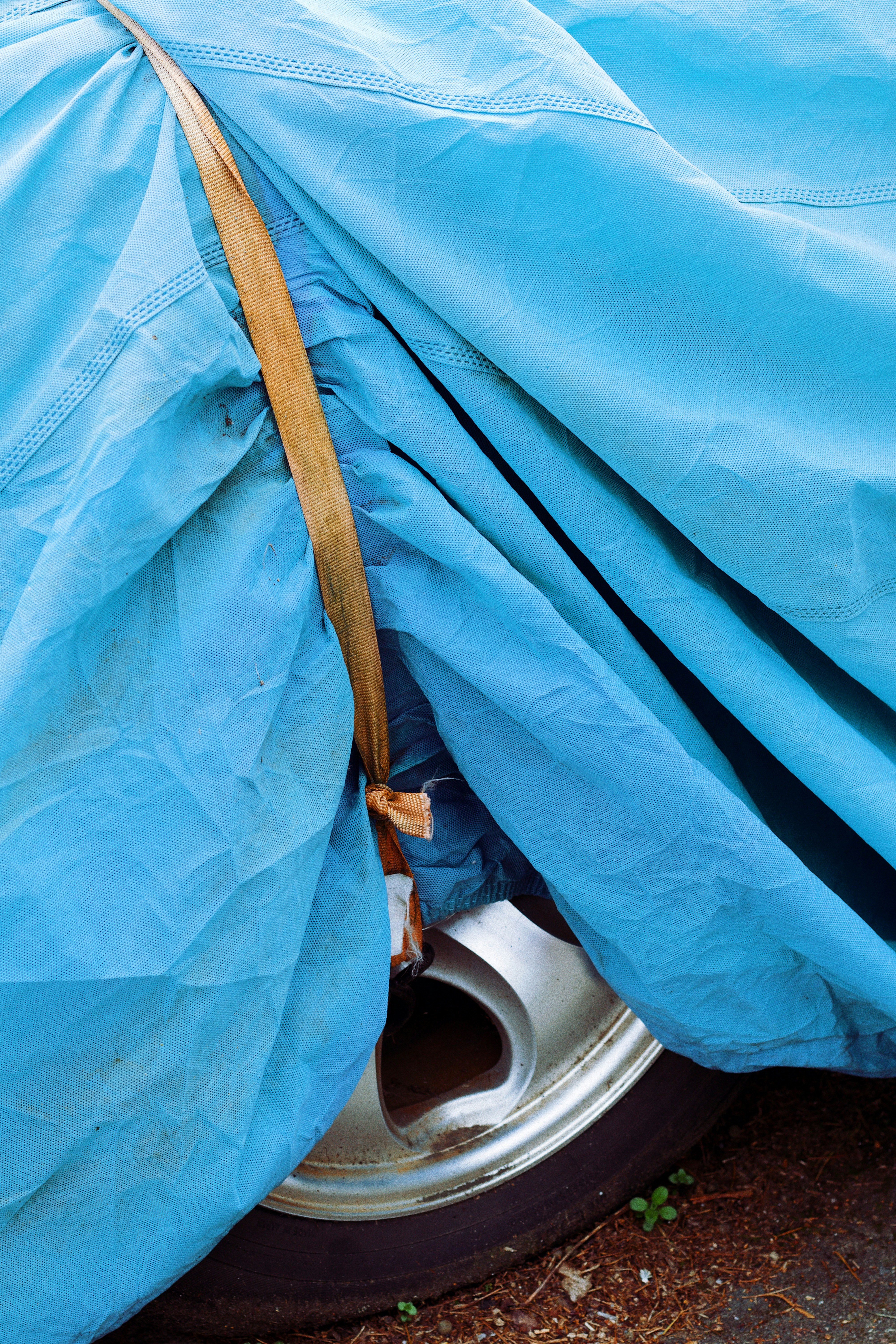 blue textile on white ceramic sink
