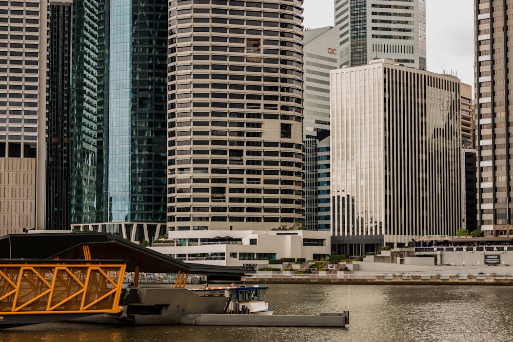 white and blue high rise buildings near body of water during daytime