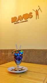 Vibrant display of Brazilian desserts and ice creams with bright tropical decorations.
