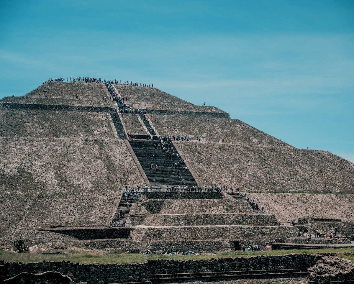 The Pyramid of the Sun at Teotihuacan, Mexico, with visitors walking along the Avenue of the Dead