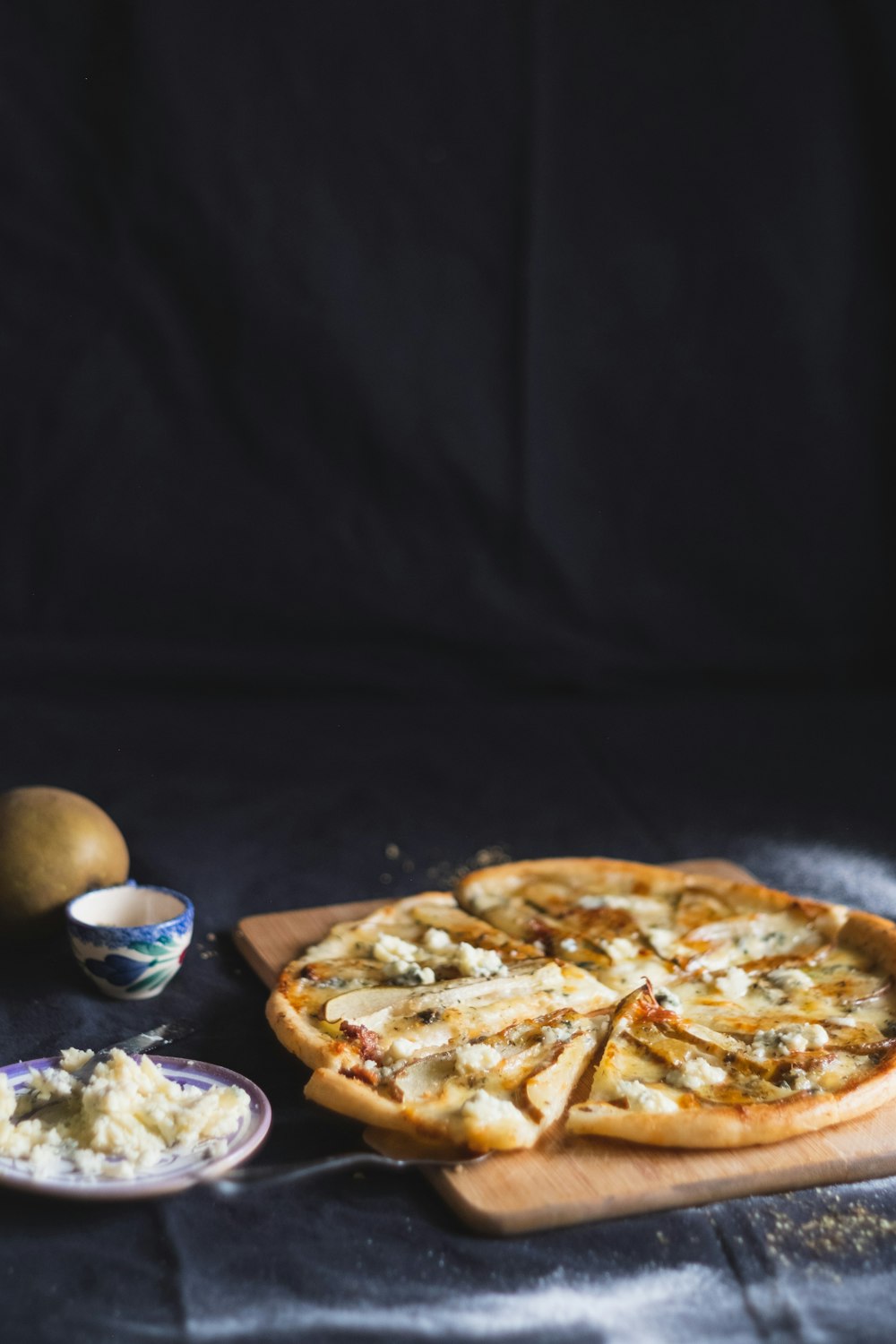 pizza on brown wooden tray