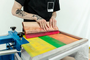 person in black t-shirt holding brown wooden board