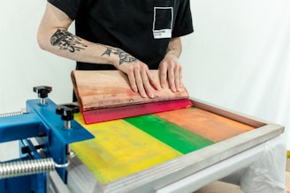 person in black t-shirt holding brown wooden board