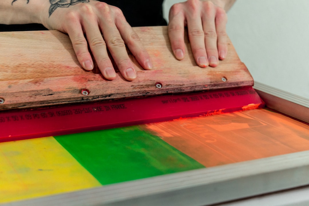 person holding brown wooden board