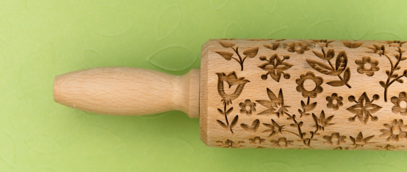 brown and beige floral wooden hand tool