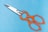 silver scissors on blue surface