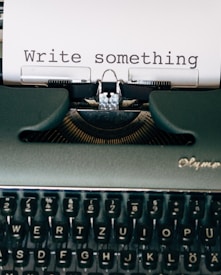 black and white typewriter on green table