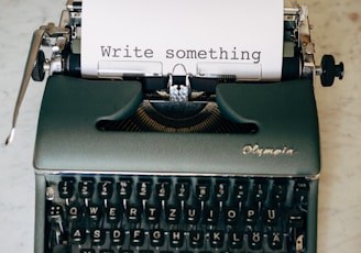 black and white typewriter on green table