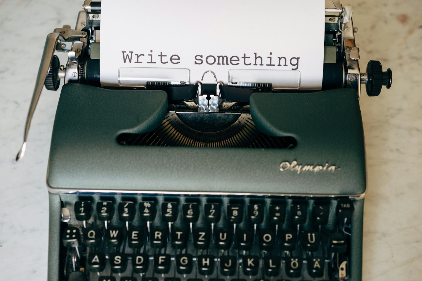 Typewriter with a sheet of paper ready for writing