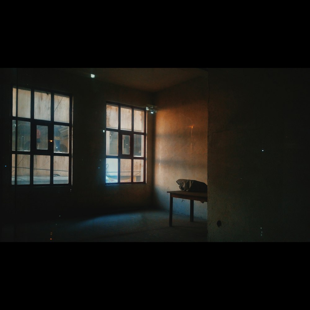 brown wooden table beside brown wall