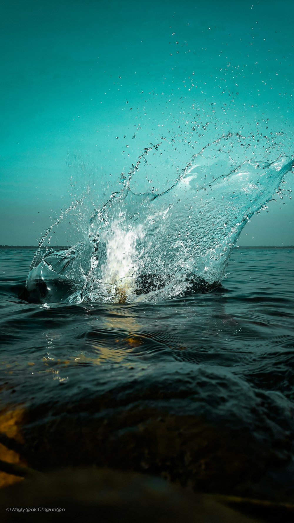 water splash on body of water