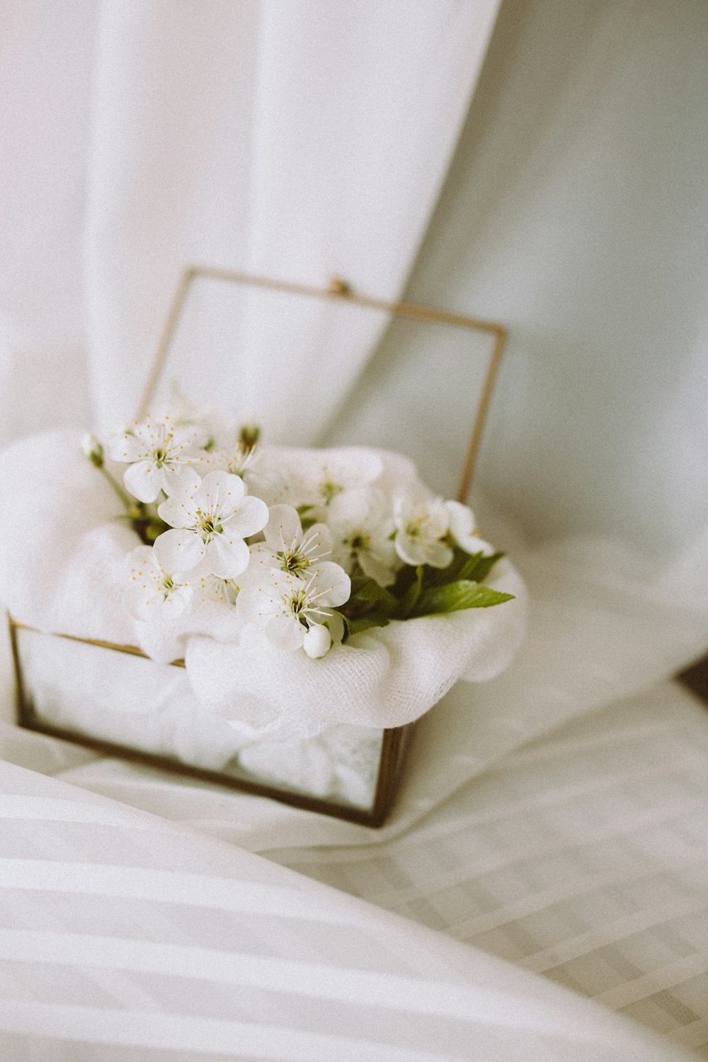 white flower on white textile