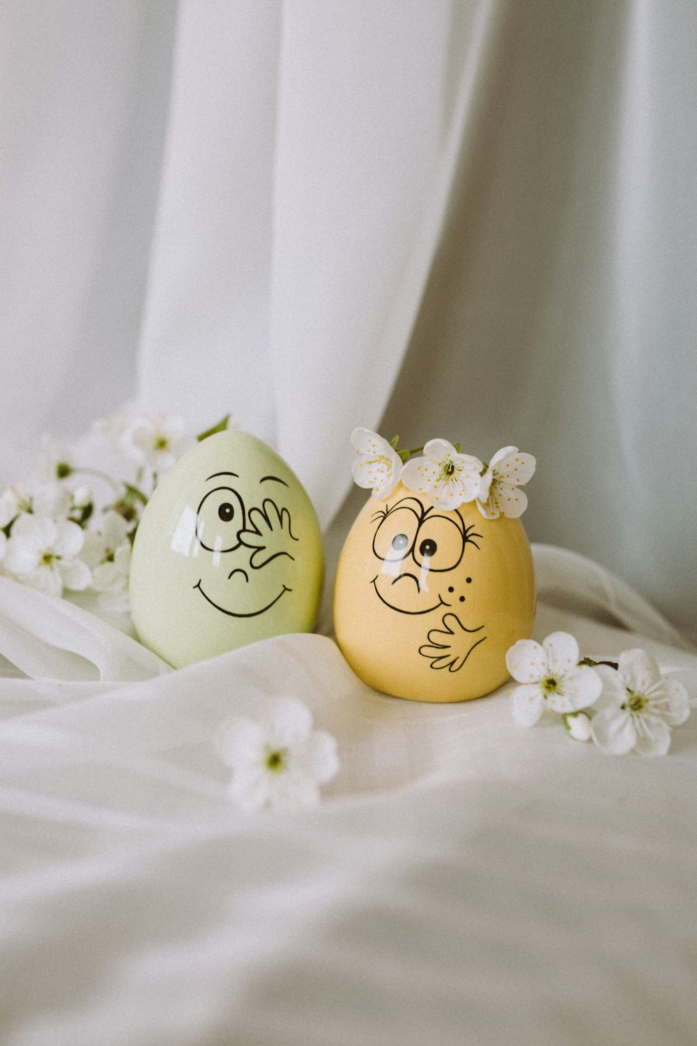 white and yellow floral egg ornament