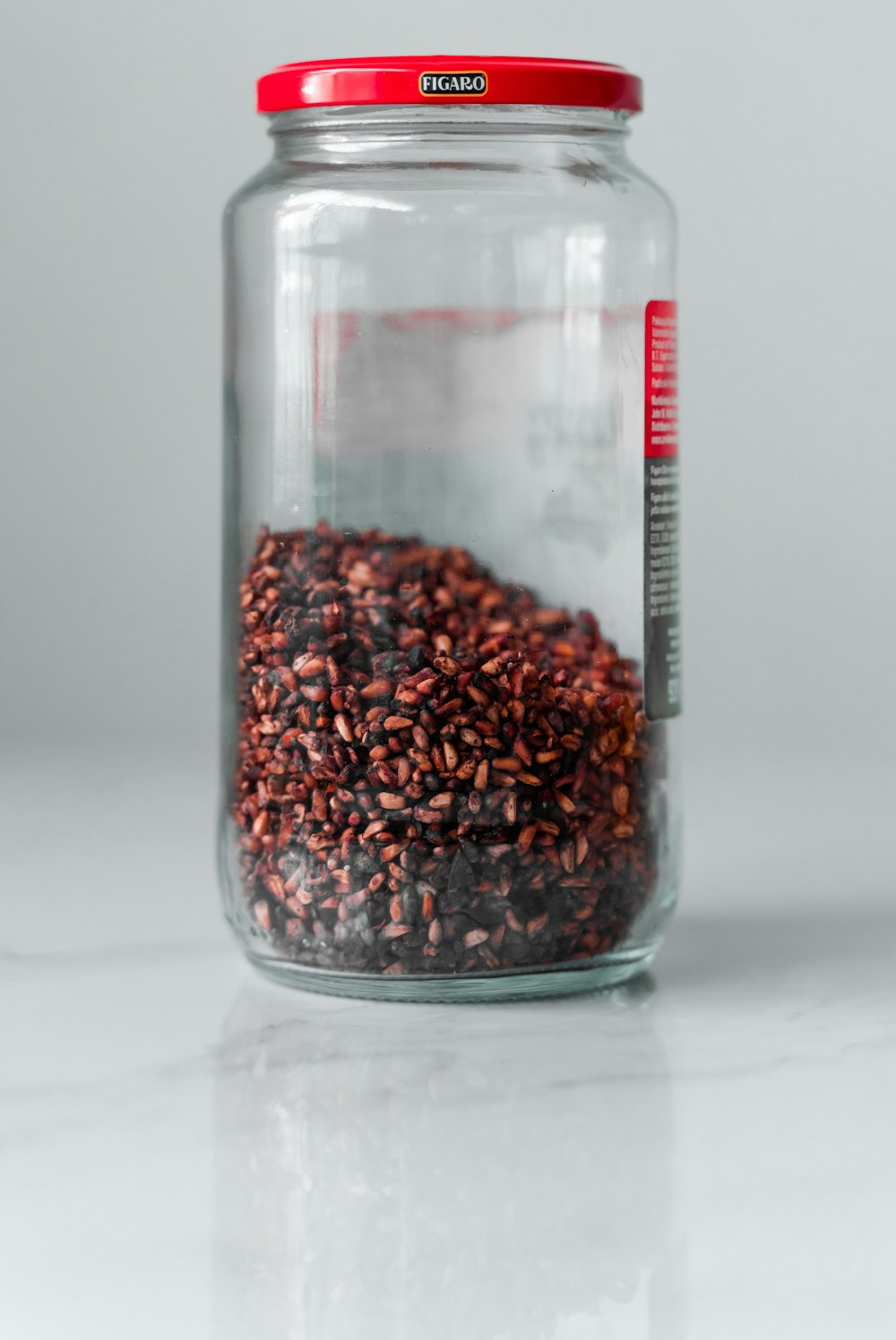brown beans in clear glass jar