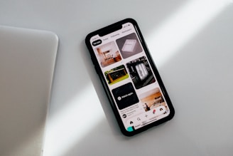 black iphone 5 on white table