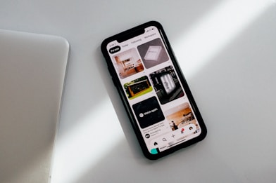 black iphone on white table
