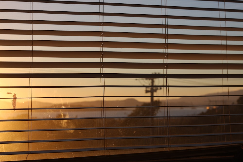 brown window blinds during daytime