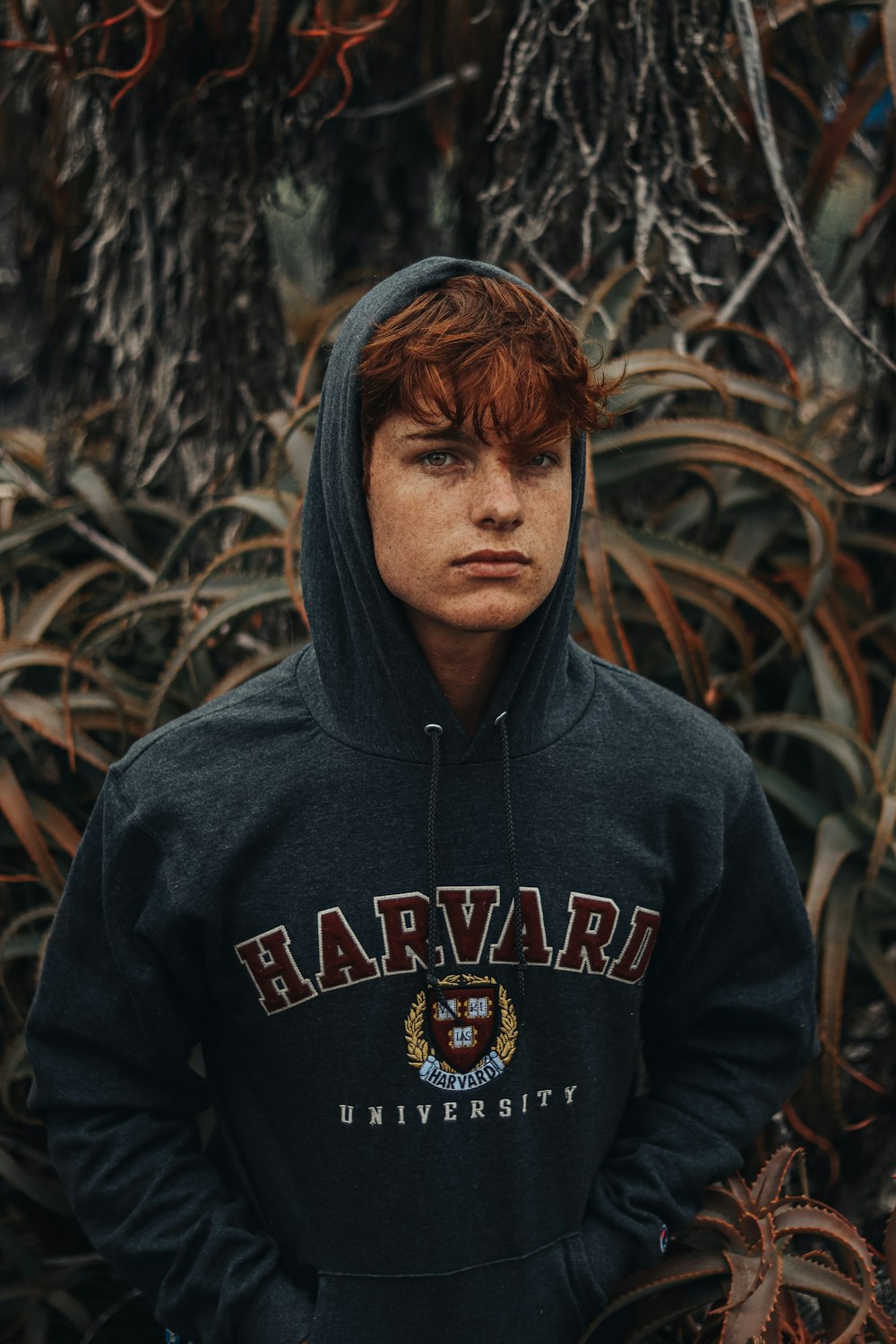 man in black and orange hoodie