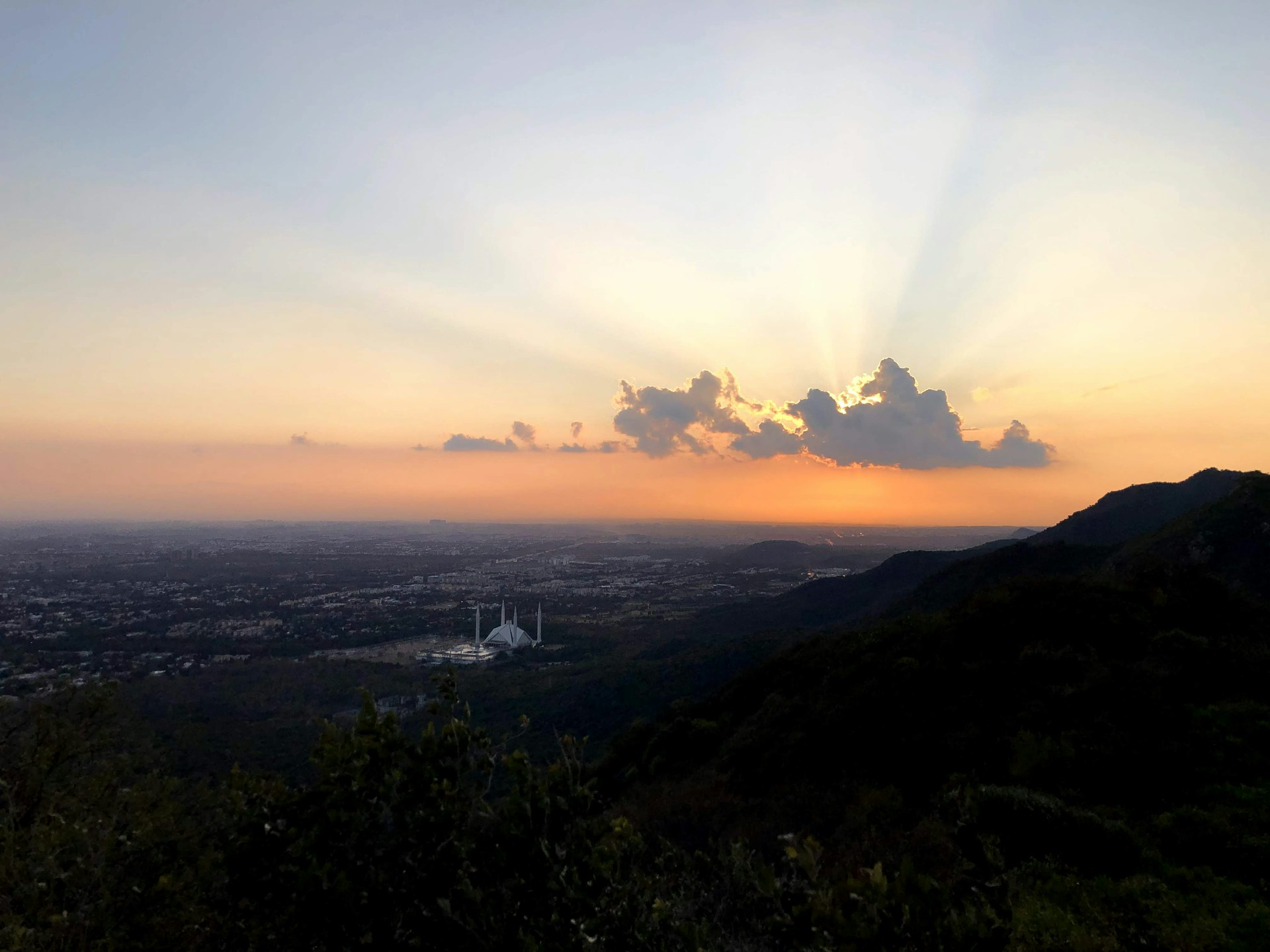 woman wearing yellow long-sleeved dress under white clouds and blue sky during daytime