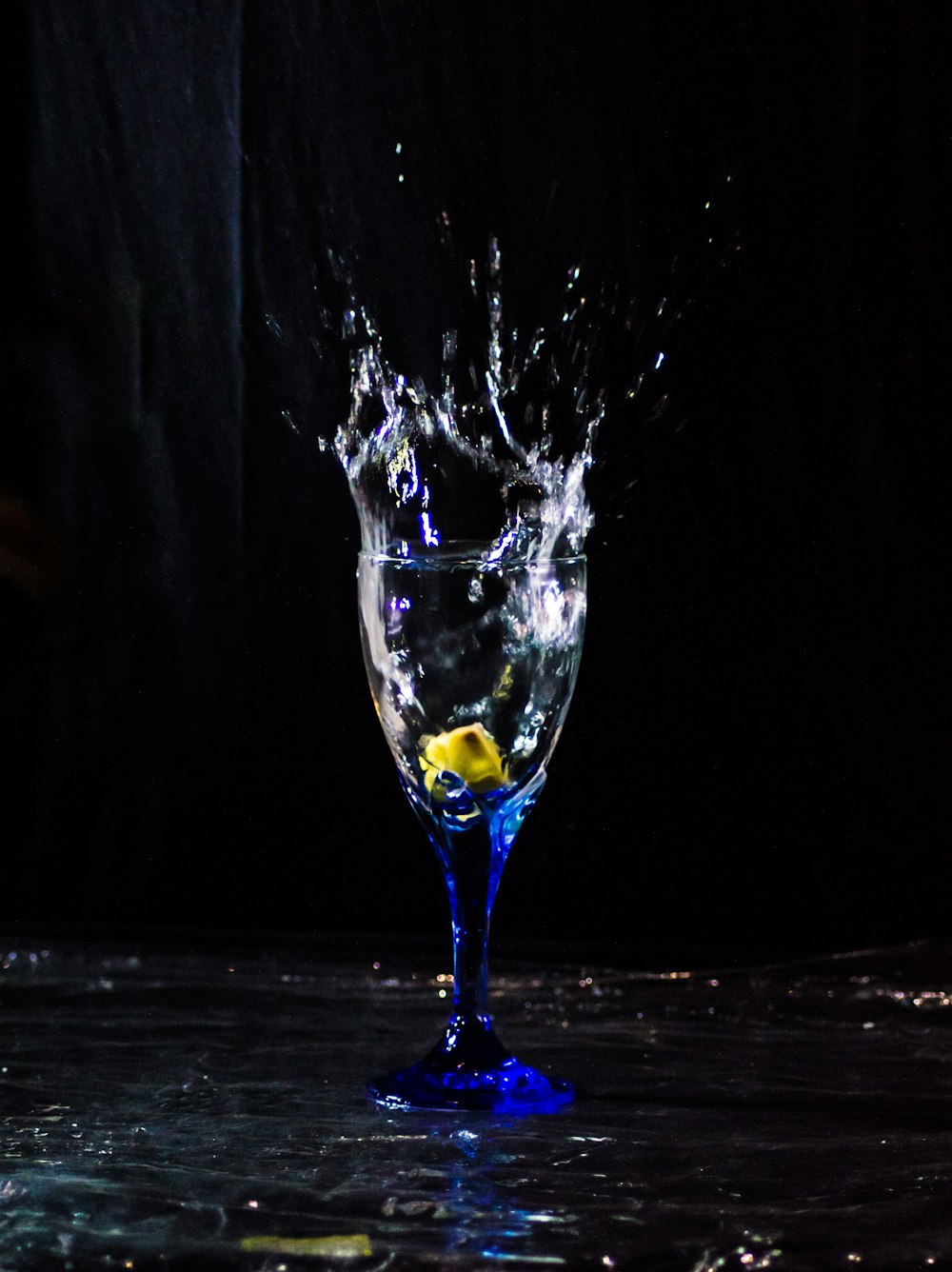 clear wine glass with yellow liquid