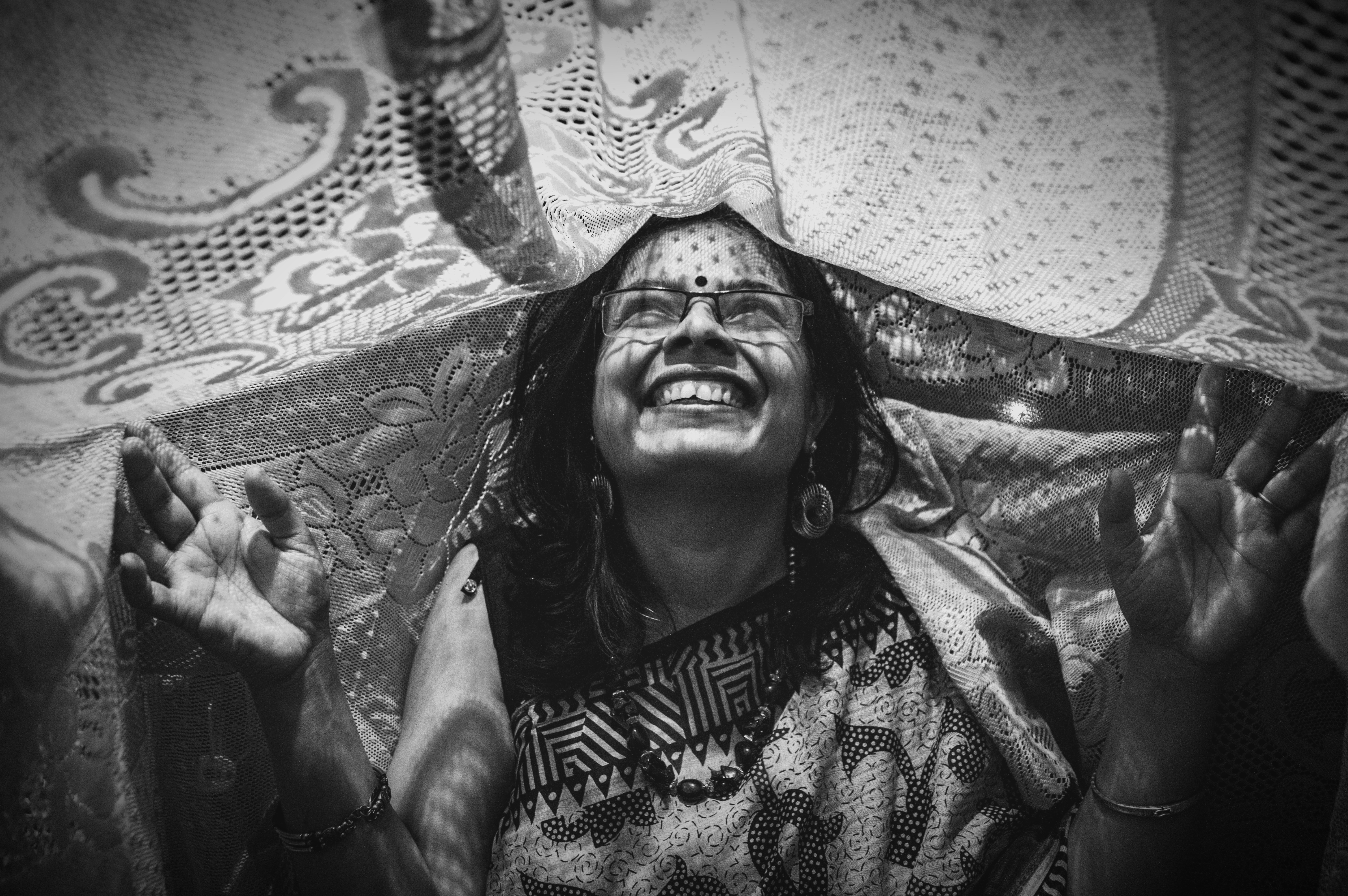 Grayscale portrait of woman wearing jewellery