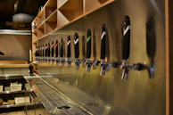 Rows of gleaming taps lined up behind the bar, each labeled with a different bräuheim brew.