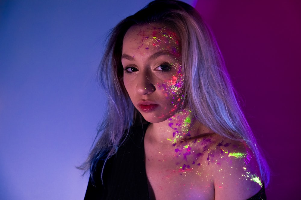 woman with purple and yellow powder on her face