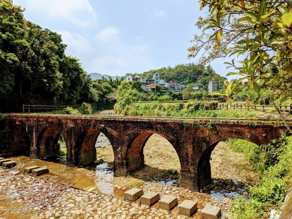 brown brick bridge over river