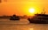 white and black boat on sea during sunset