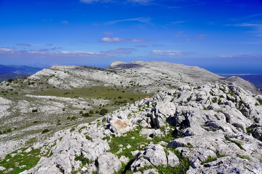 gray rocky mountain under blue sky during daytime