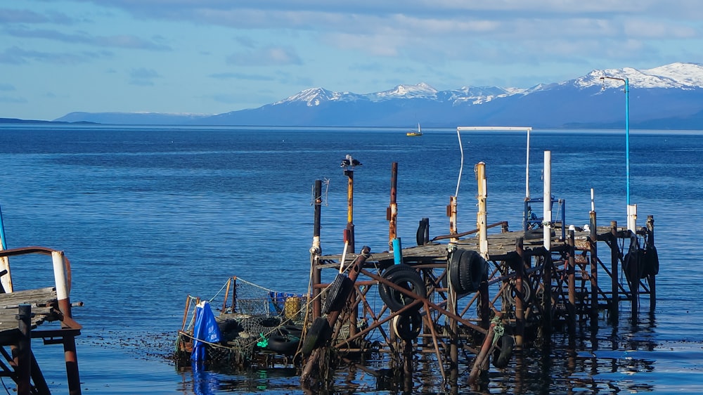 brown wooden boat on sea dock during daytime