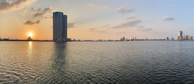 city skyline across body of water during daytime