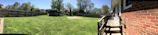 A beautifully crafted privacy fence surrounding a cozy backyard.