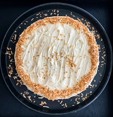 white pasta on black ceramic plate