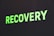 The word 'RECOVERY' is written in bright green capital letters against a dark background.