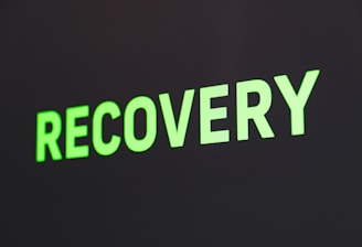 a close up of a sign that reads recovery