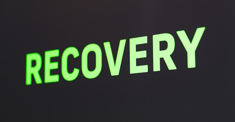 a close up of a sign that reads recovery