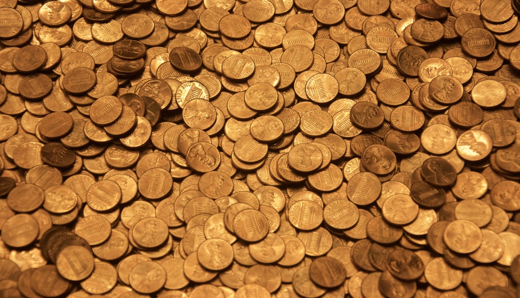 brown round coins on brown wooden surface