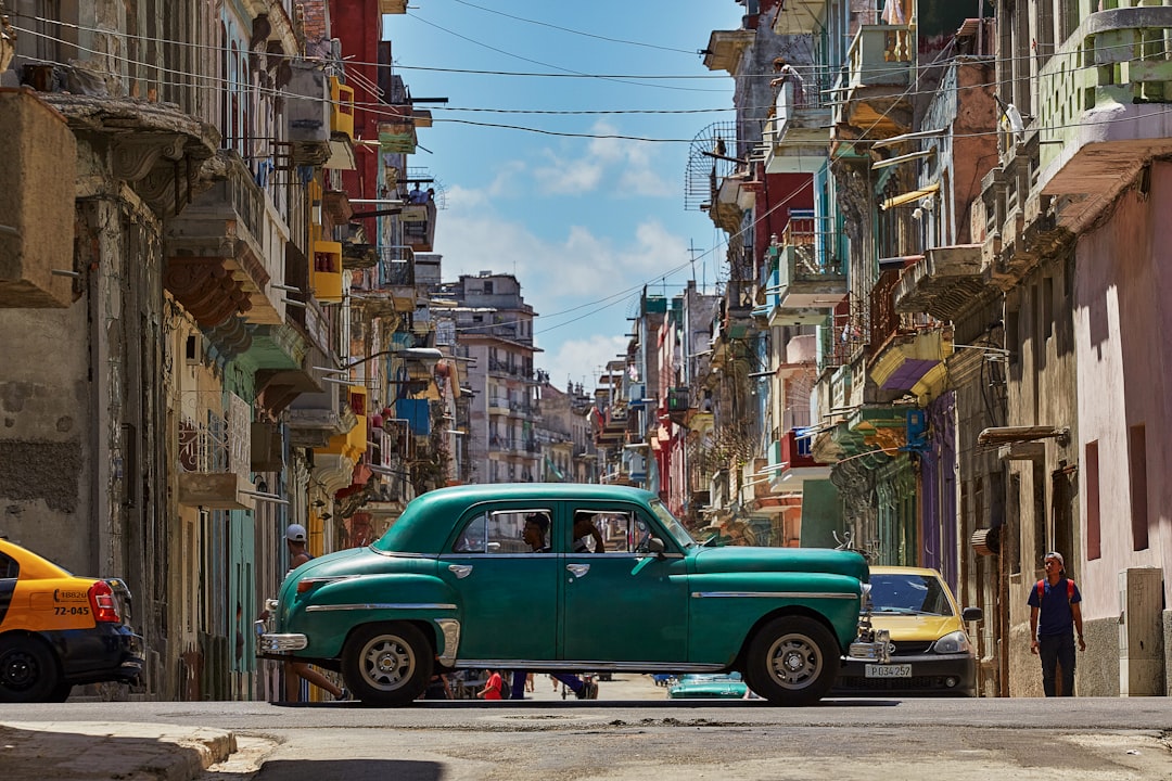 green car parked on side of the road