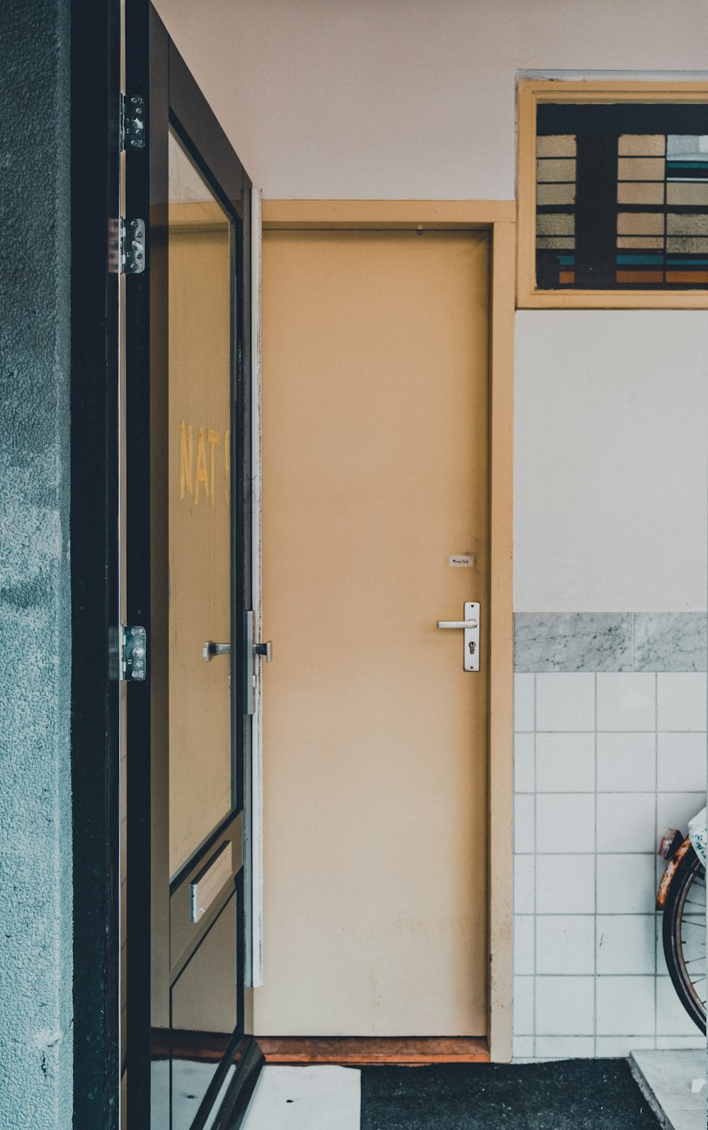 brown wooden door with silver door lever