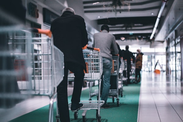 Waiting in a queue with shopping carts