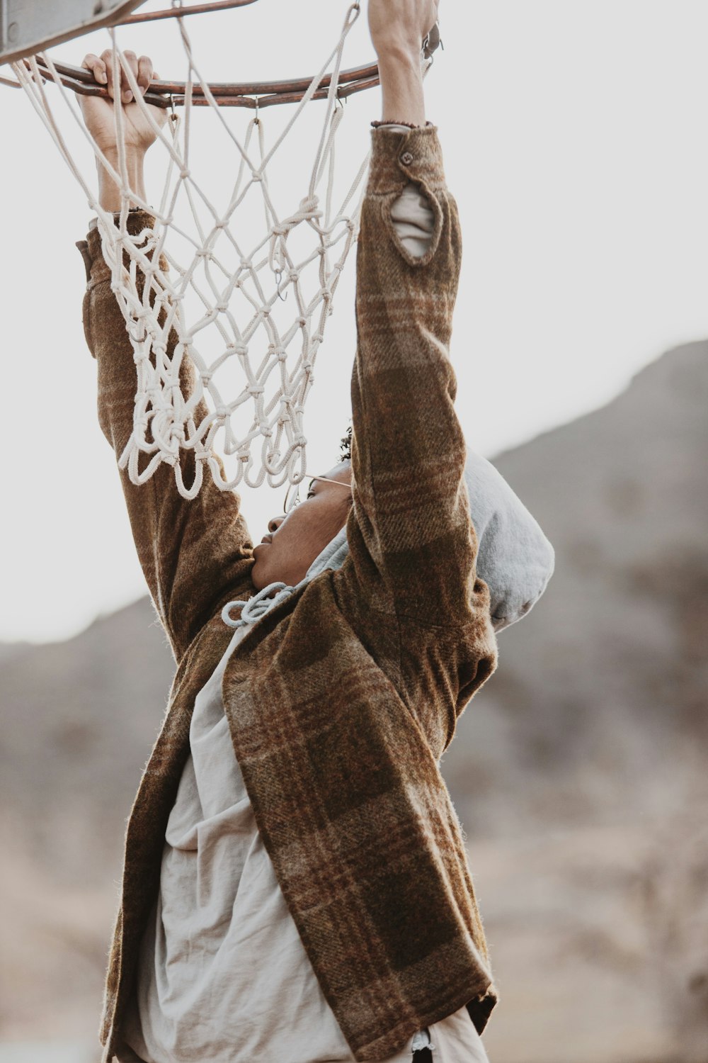 a man is holding a basketball in the air