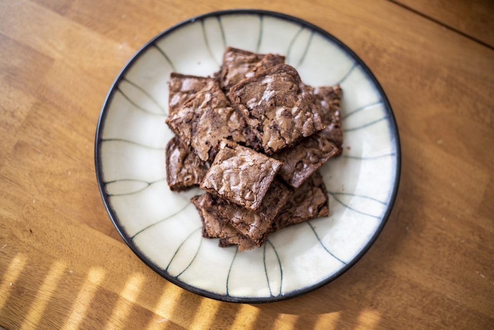 brown cookies on white and blue ceramic plate