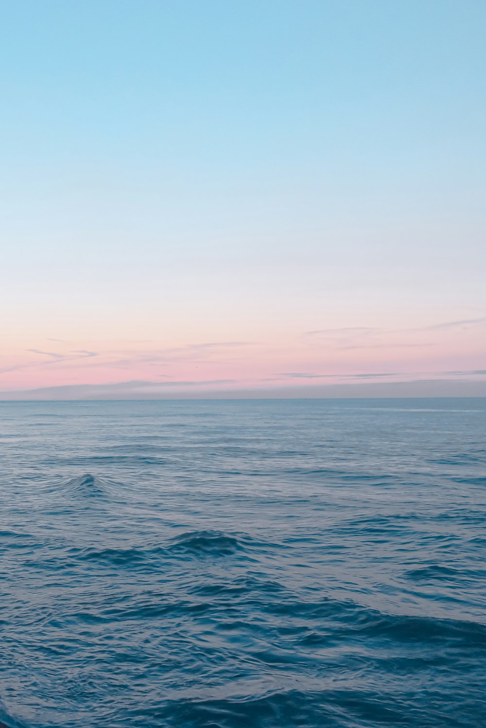 blue sea under blue sky during daytime