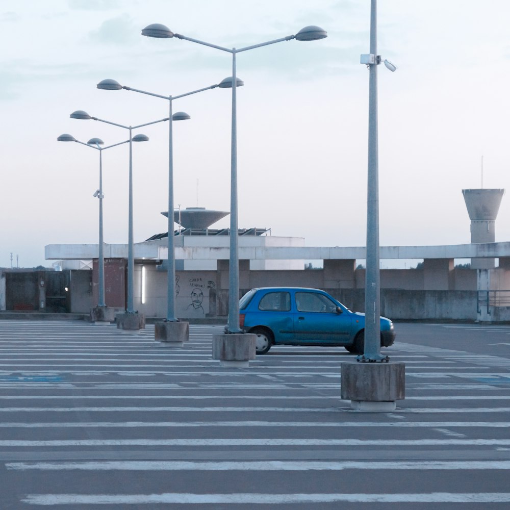 blue car on road during daytime