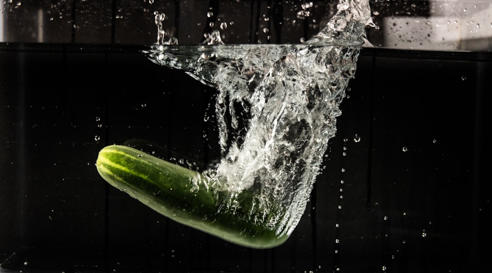 water splash on green leaf