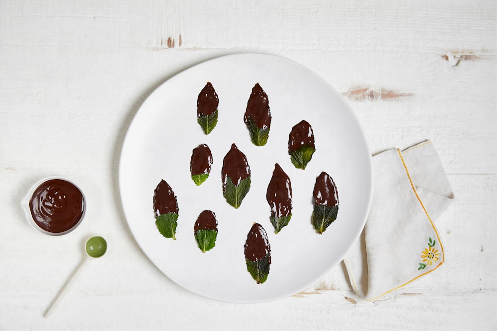 red strawberries on white ceramic plate